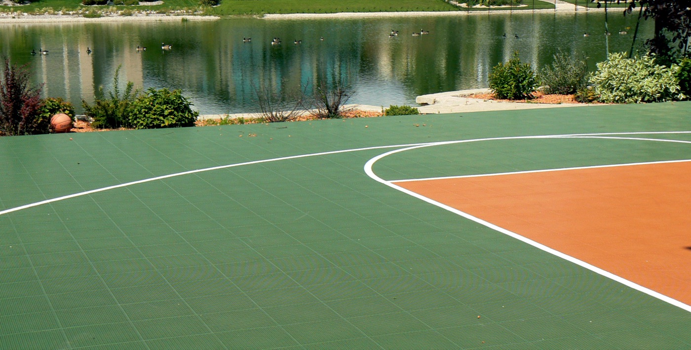 Multi-sport game court beside a pond
