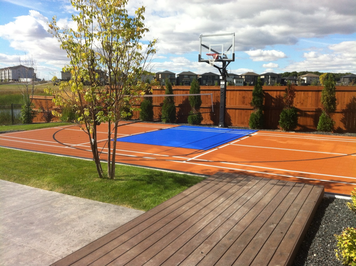 Backyard basketball court in blue and orange
