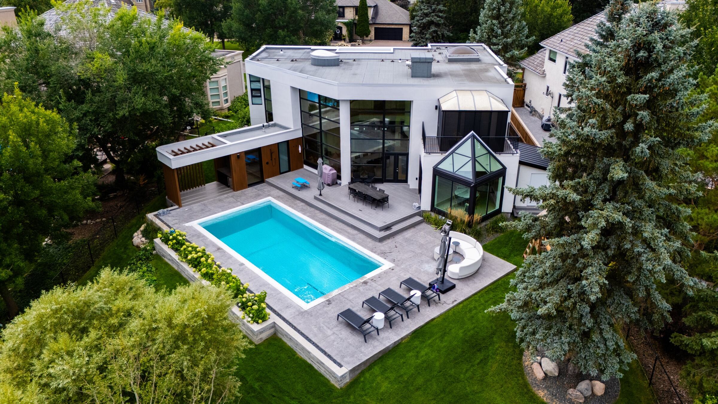 Finished modern home landscape with pool, from above