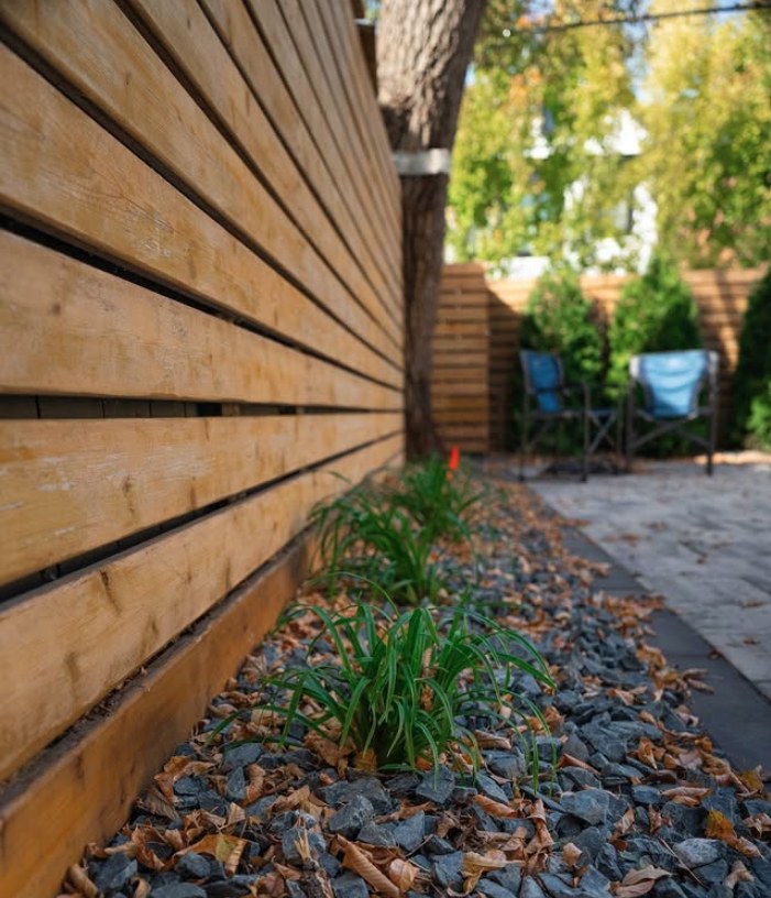 Modern horizontal fence with ornamental grasses