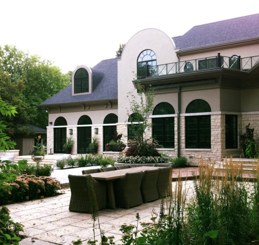 Stone estate with formal patio