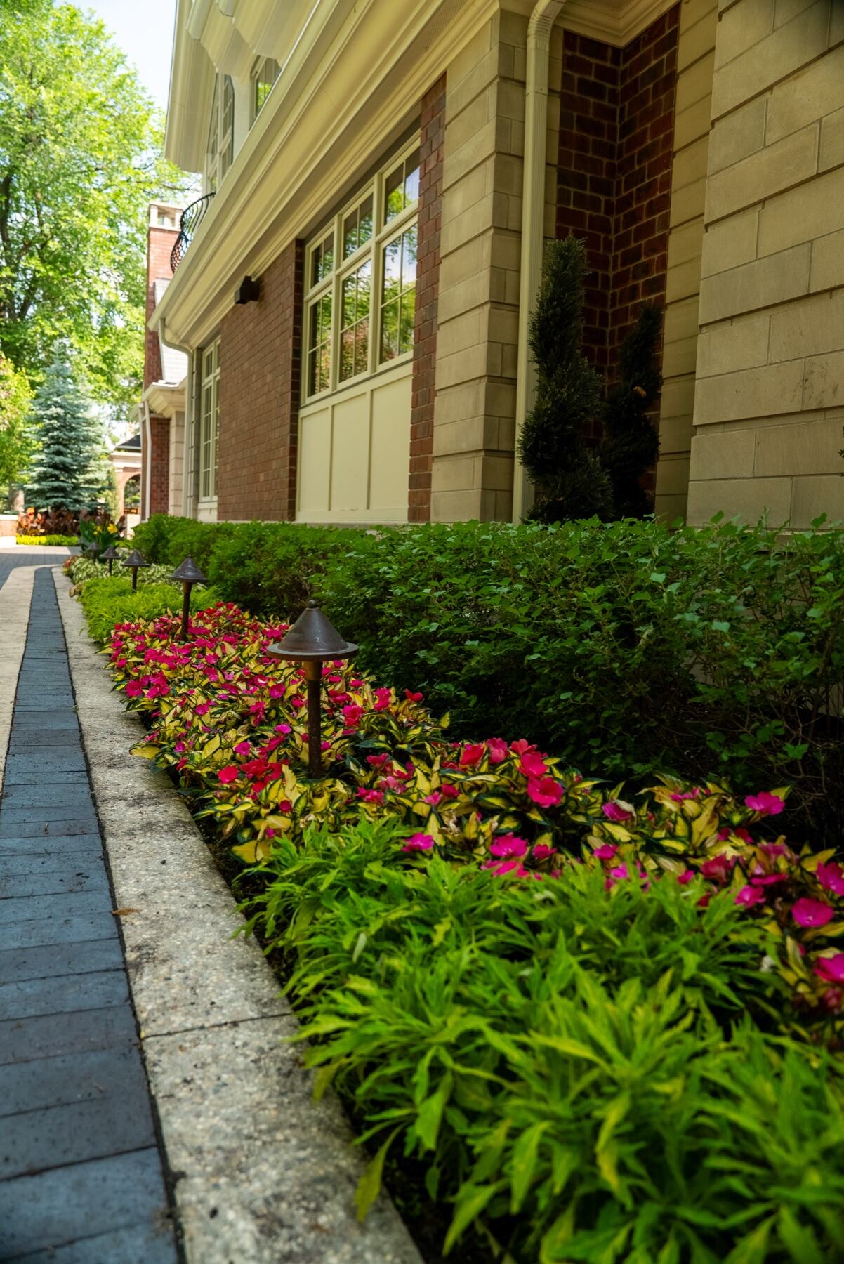 Garden path through lush perennial beds on a 3 Seasons estate project