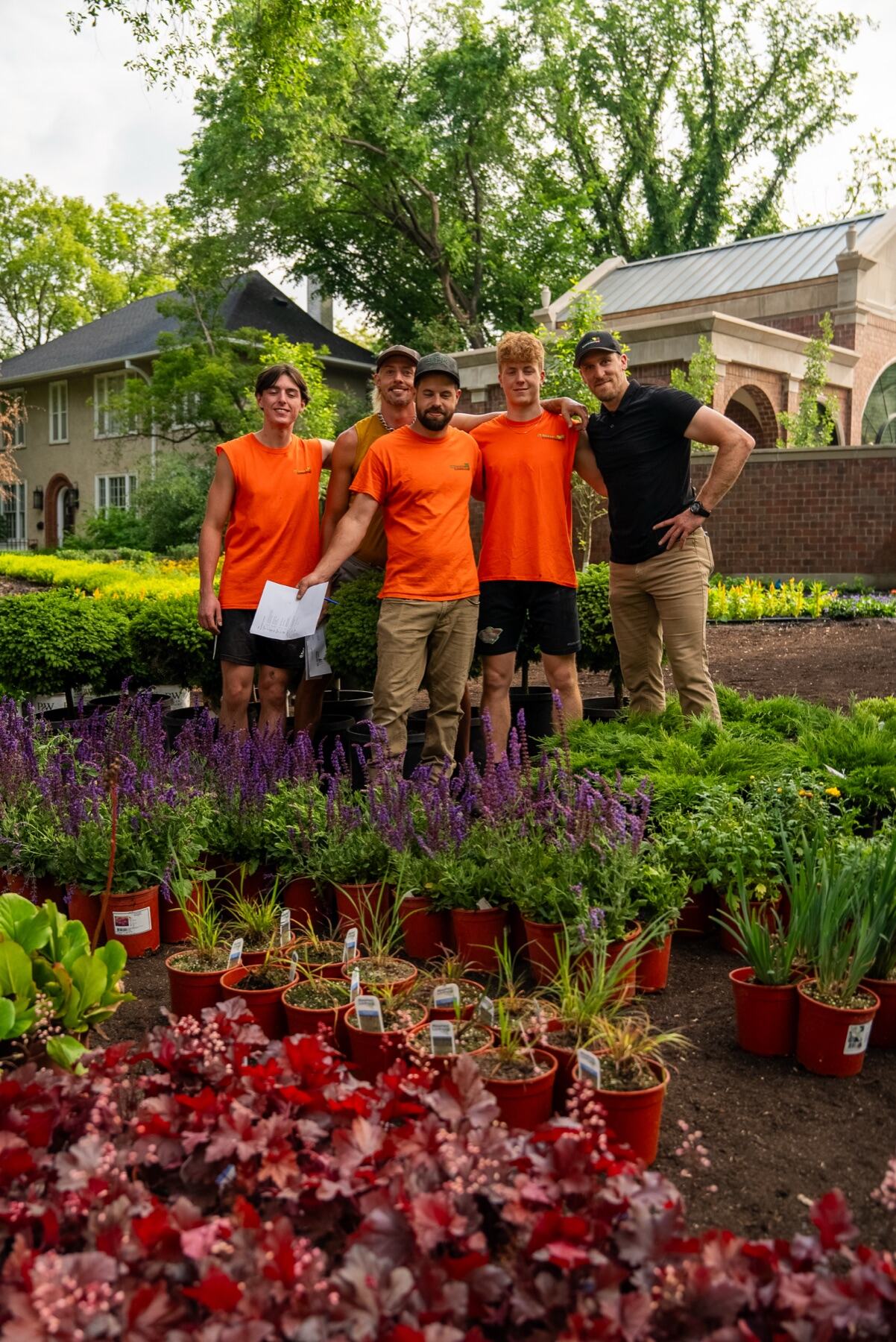 The 3 Seasons Landscaping crew among fresh nursery stock
