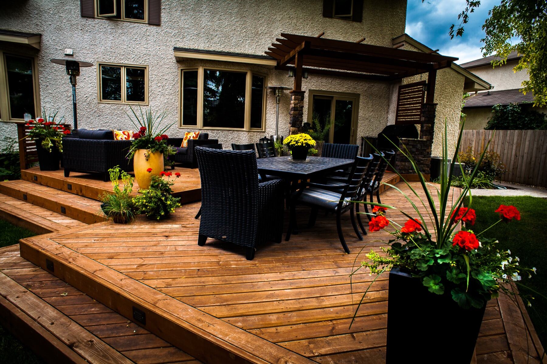 Cedar deck with outdoor dining table and planters