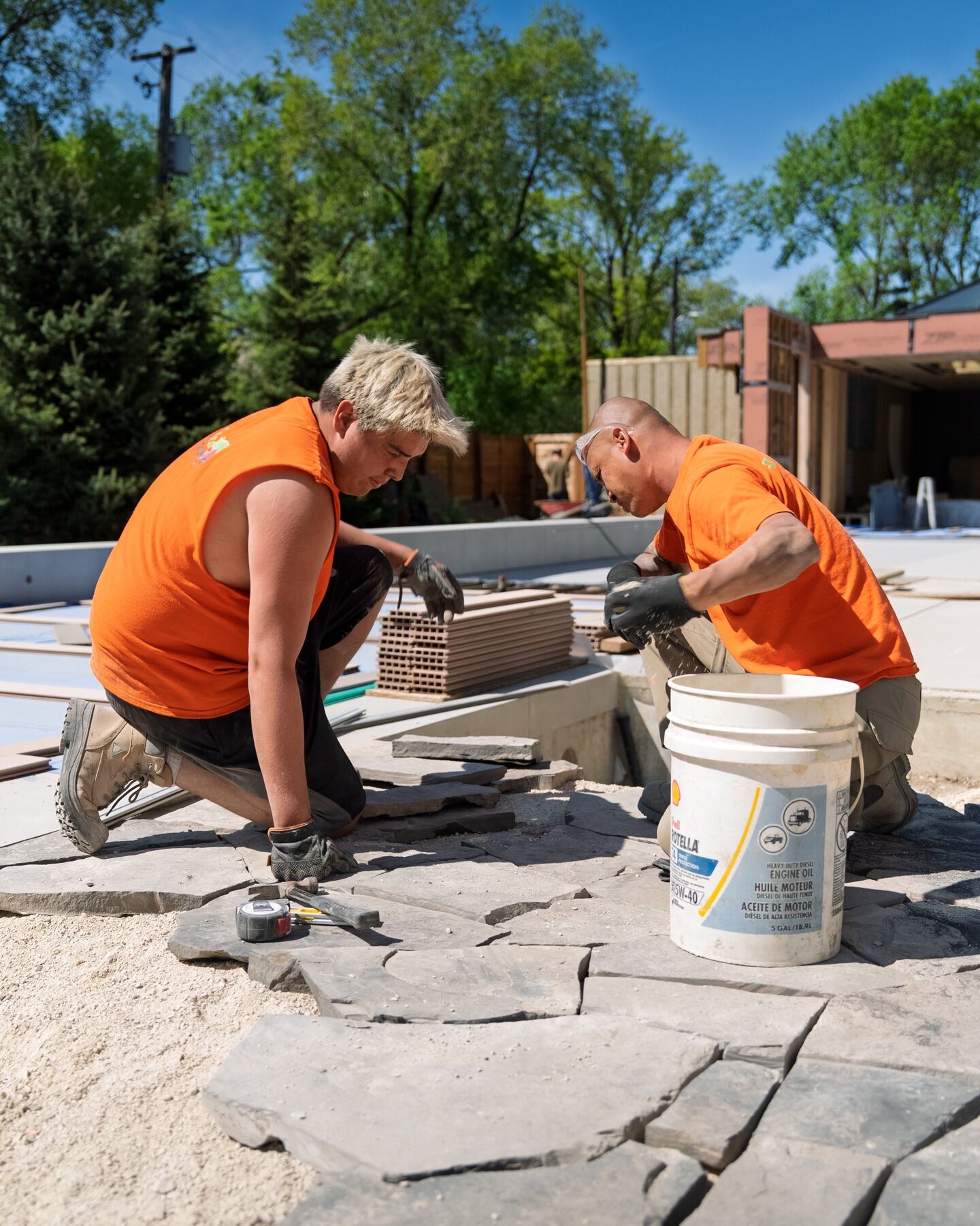3 Seasons crew installing natural stone paving at 430 Hosmer