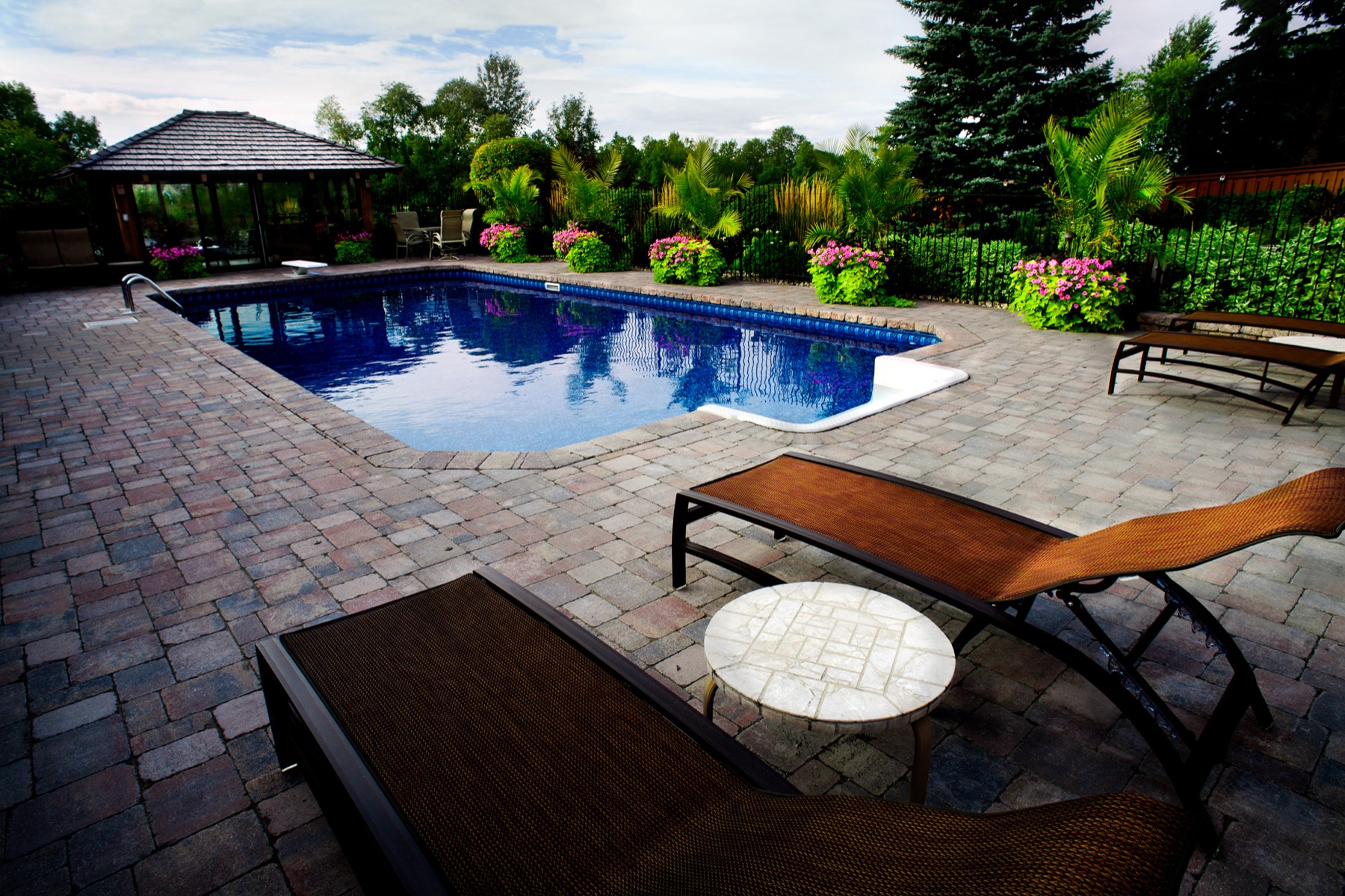 Backyard pool with gazebo and pergola
