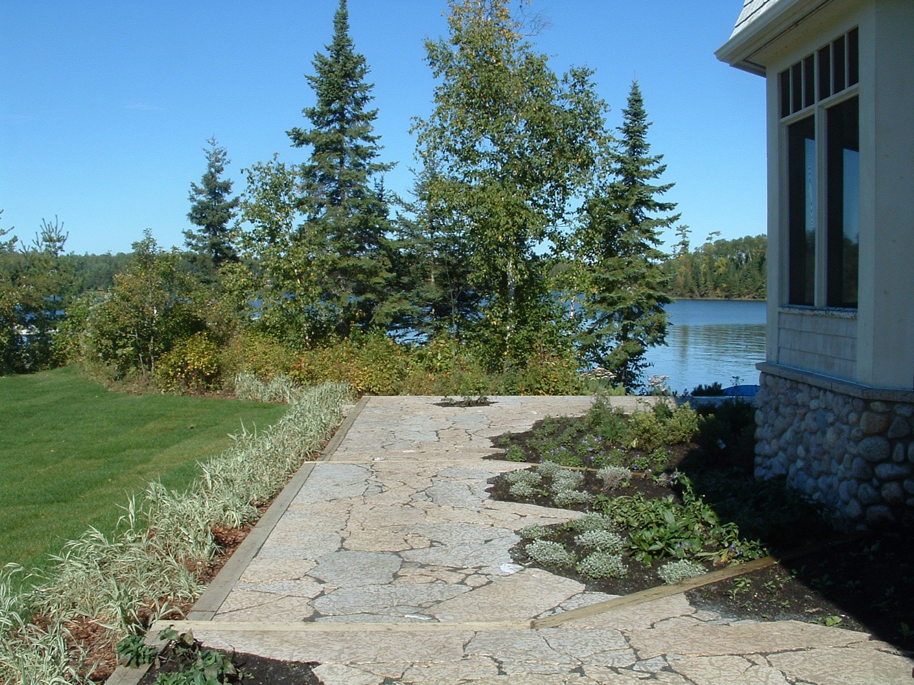 Stone estate with formal patio